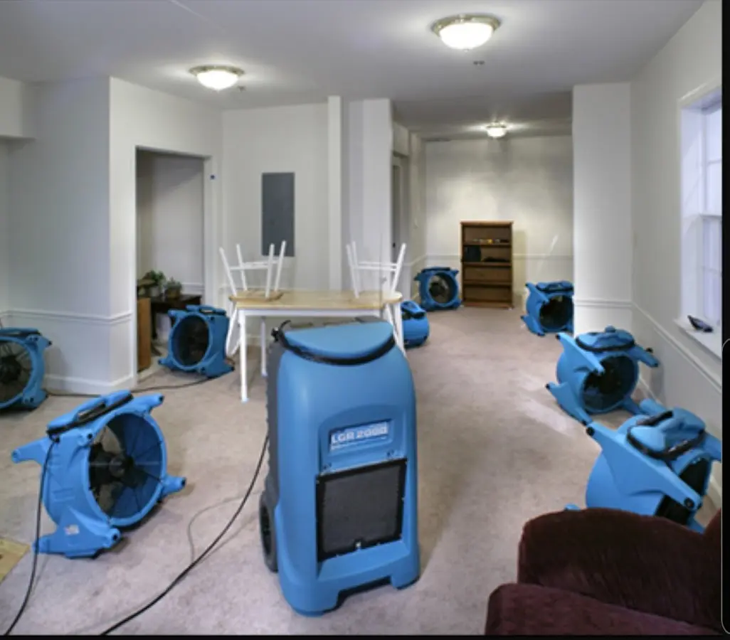Air movers and dehumidifier setup for Water Damage Restoration in Busti
